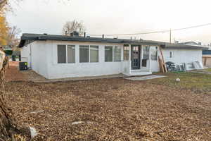 Back of property with stucco siding