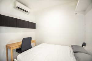 Bedroom featuring Murpheybed and AC wall unit
