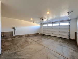 Garage featuring baseboards