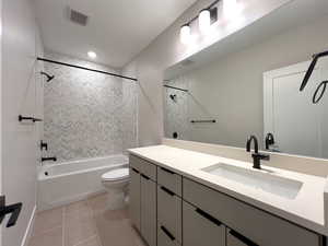 Full bathroom with vanity, tub / shower combination, and light tile patterned floors