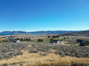 View of mountain backdrop with a nearby body of water