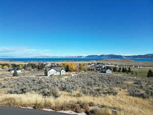 View of mountain backdrop featuring a large body of water