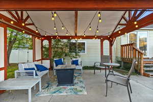 View of patio / terrace featuring an outdoor living space with a fire pit