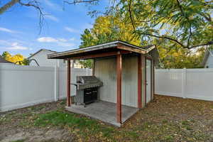 View of shed featuring a fenced backyard