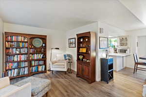 Living area featuring light wood finished floors and baseboards