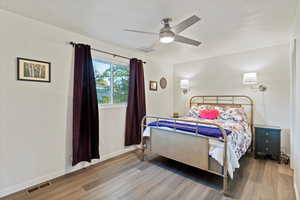 Bedroom featuring light wood-style flooring and a ceiling fan