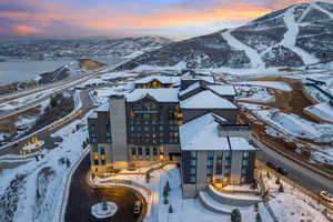 Snowy aerial view featuring a mountain view