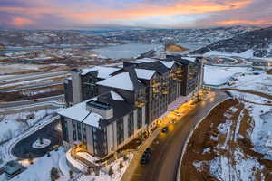 Snowy aerial view featuring a mountain view