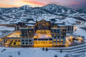 Snowy aerial view featuring a mountain view