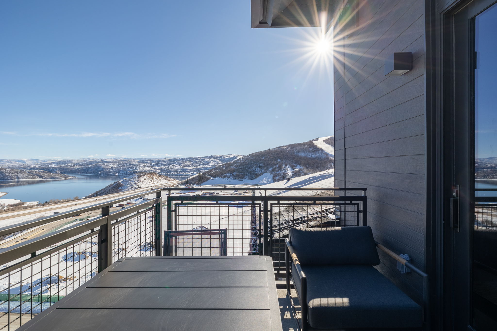 Private balcony with a water and mountain view