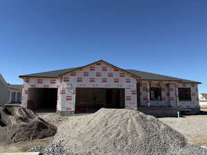 Property under construction with roof with shingles