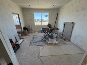 Unfurnished dining area with a textured ceiling