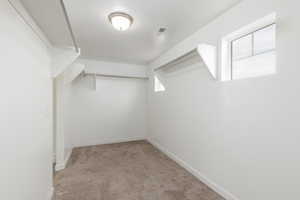 Large walk in closet with natural light