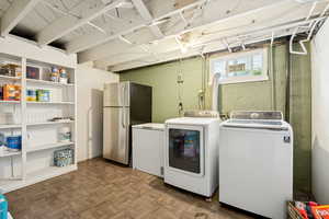 Washroom featuring independent washer and dryer