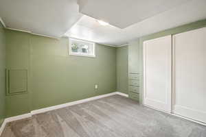 Unfurnished bedroom featuring carpet flooring and baseboards