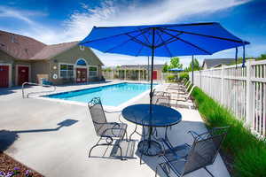 Community pool with a patio area