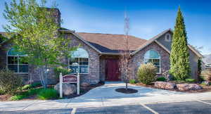 View of front of home featuring stone siding