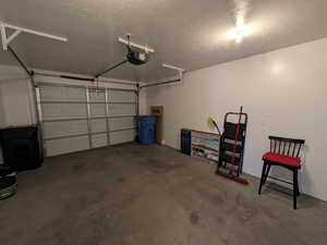 Garage featuring a garage door opener