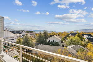 Balcony with a mountain view and a residential view