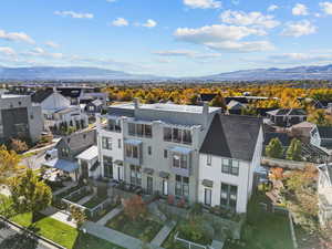 Aerial view of residential area featuring a mountainous background