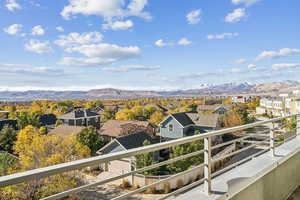 Balcony featuring a mountain view and a residential view