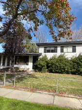 View of front of home featuring a fenced front yard