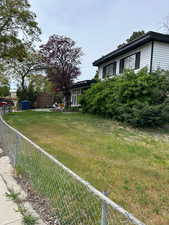 Fenced yard with a shed