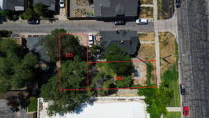 Aerial view of property and surrounding area with property parcel outlined