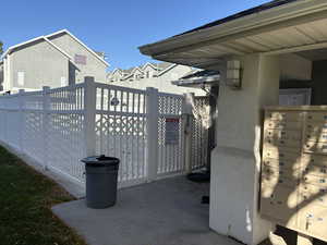 View of patio featuring mail area