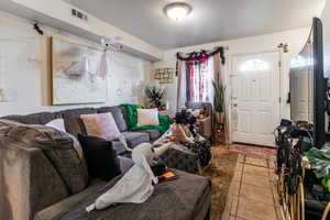 Living room with light tile patterned floors