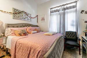 Bedroom with a textured wall