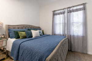 Bedroom with a textured wall