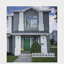 View of front of home featuring stucco siding