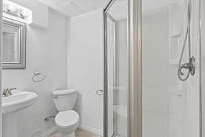 Full bathroom with a shower stall and tile patterned flooring