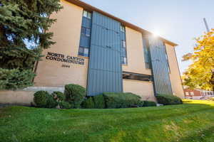 Community sign featuring a lawn