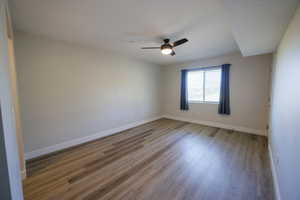 Unfurnished room with light wood-style floors and ceiling fan