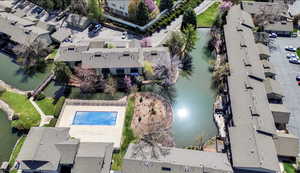 Aerial overview of property's location with a large body of water and nearby suburban area