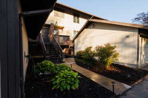 View of property exterior featuring stairs