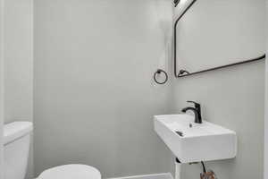 Half bath featuring toilet