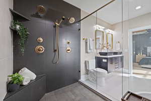 Full bath featuring vanity, ensuite bathroom, and walk in shower