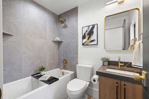 Bathroom featuring vanity and shower / tub combination