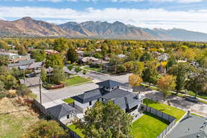 Aerial perspective of suburban area with a mountain backdrop