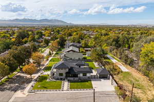 Aerial perspective of suburban area with a mountainous background
