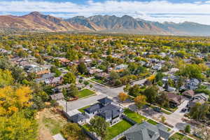 Aerial perspective of suburban area with a mountainous background