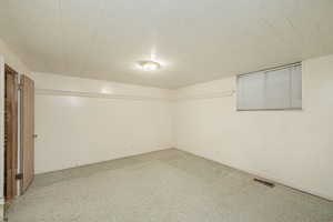 Basement bedroom featuring baseboards