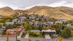 Aerial perspective of suburban area with a mountainous background