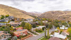 Aerial perspective of suburban area featuring a mountainous background