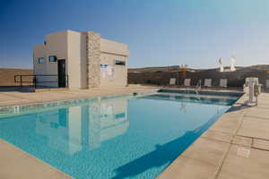 Community pool featuring a patio