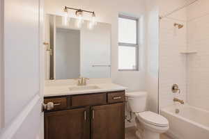 Bathroom with shower / bath combination and vanity