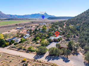 Aerial view of sparsely populated area featuring a mountain backdrop